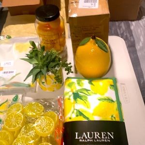 A collection of everything lemons. Includes candles, plates, table cloth, etc